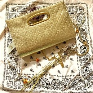 Charming Charlie clutch. Gold with removable gold chain cross body strap.